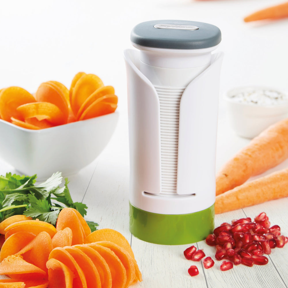The Zyliss Spiralizer is a white and green plastic, cylindrical tool with a gray top and open front displaying a ridged interior, designed for easy gripping and opening of jars or bottles.