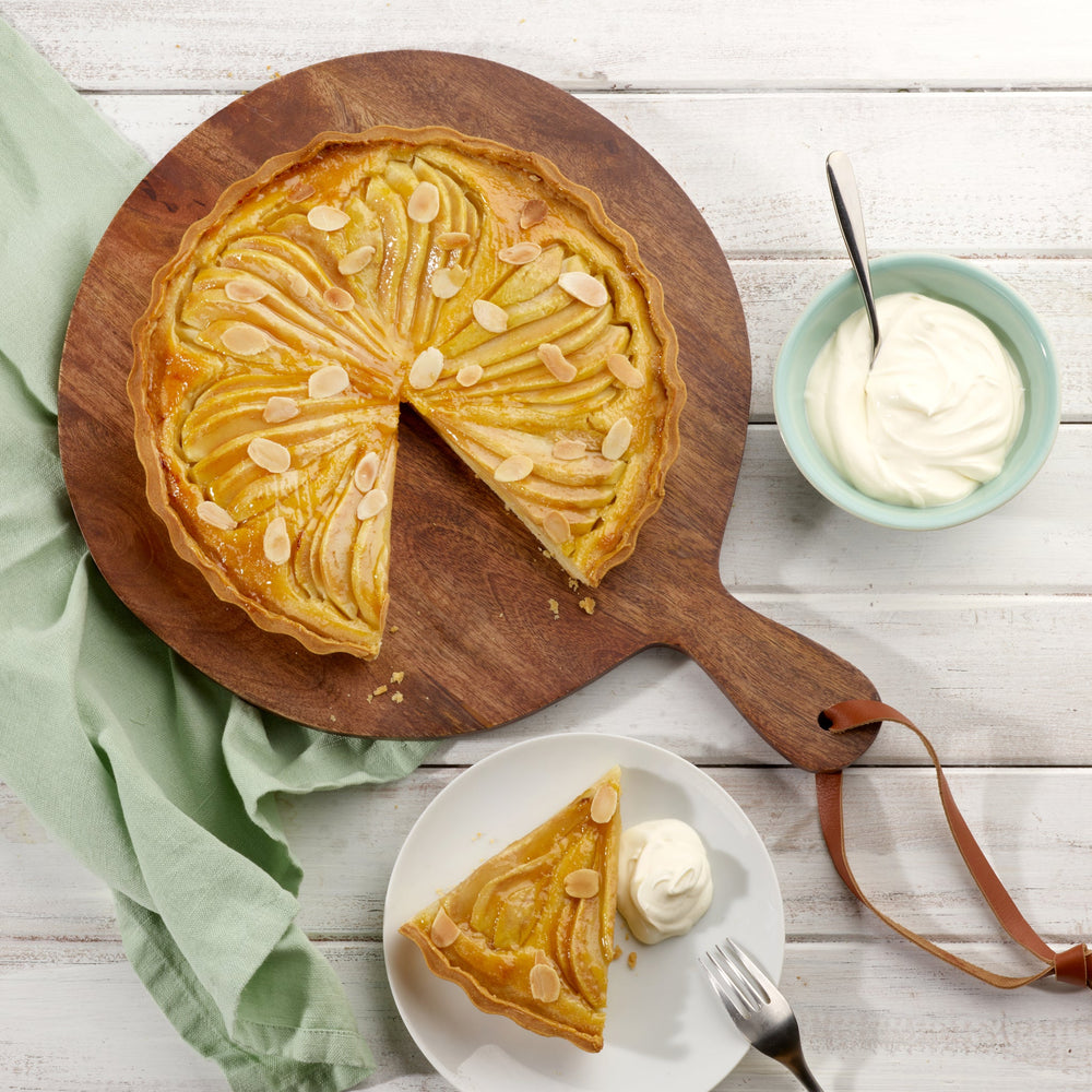 The Zyliss Durable Non-Stick Tart Pan, made from strong carbon steel with fluted edges and a non-stick coating, is shown on a plain light background—ideal for baking tarts or quiches.