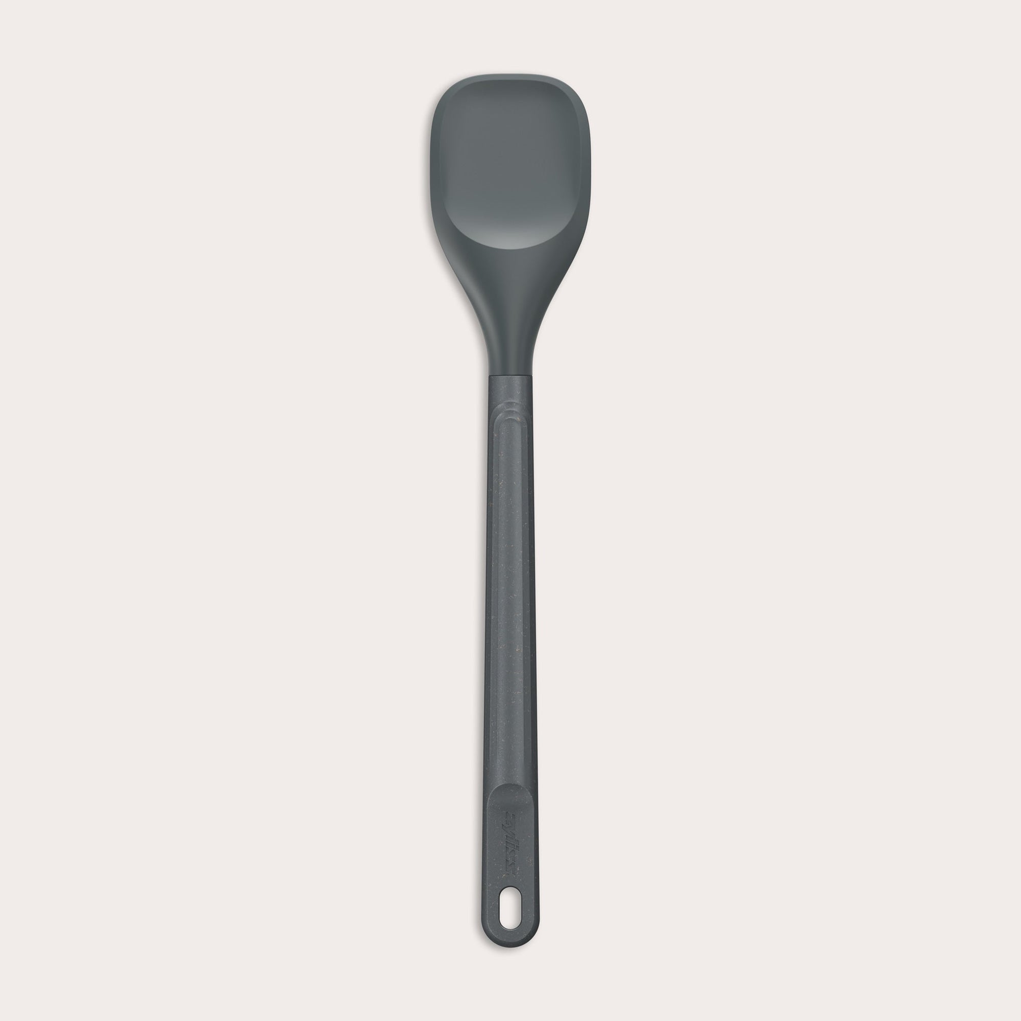 The Zyliss Spoontula is dark gray, with a silicone head, long ergonomic handle, and a gently rounded rectangular bowl, pictured on a plain light background. #Medium