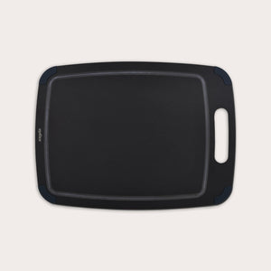 The Zyliss Wood Fibre Cutting Board, black and rectangular with a handle and rounded corners, made from recycled wood fibres, is shown on a light background. #Large