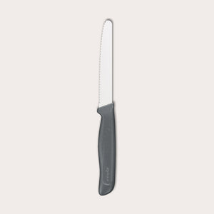 The Zyliss Tomato Knife Serrated 11cm / 4½ features a silver serrated blade and an eco-friendly handle, shown against a plain white background. 