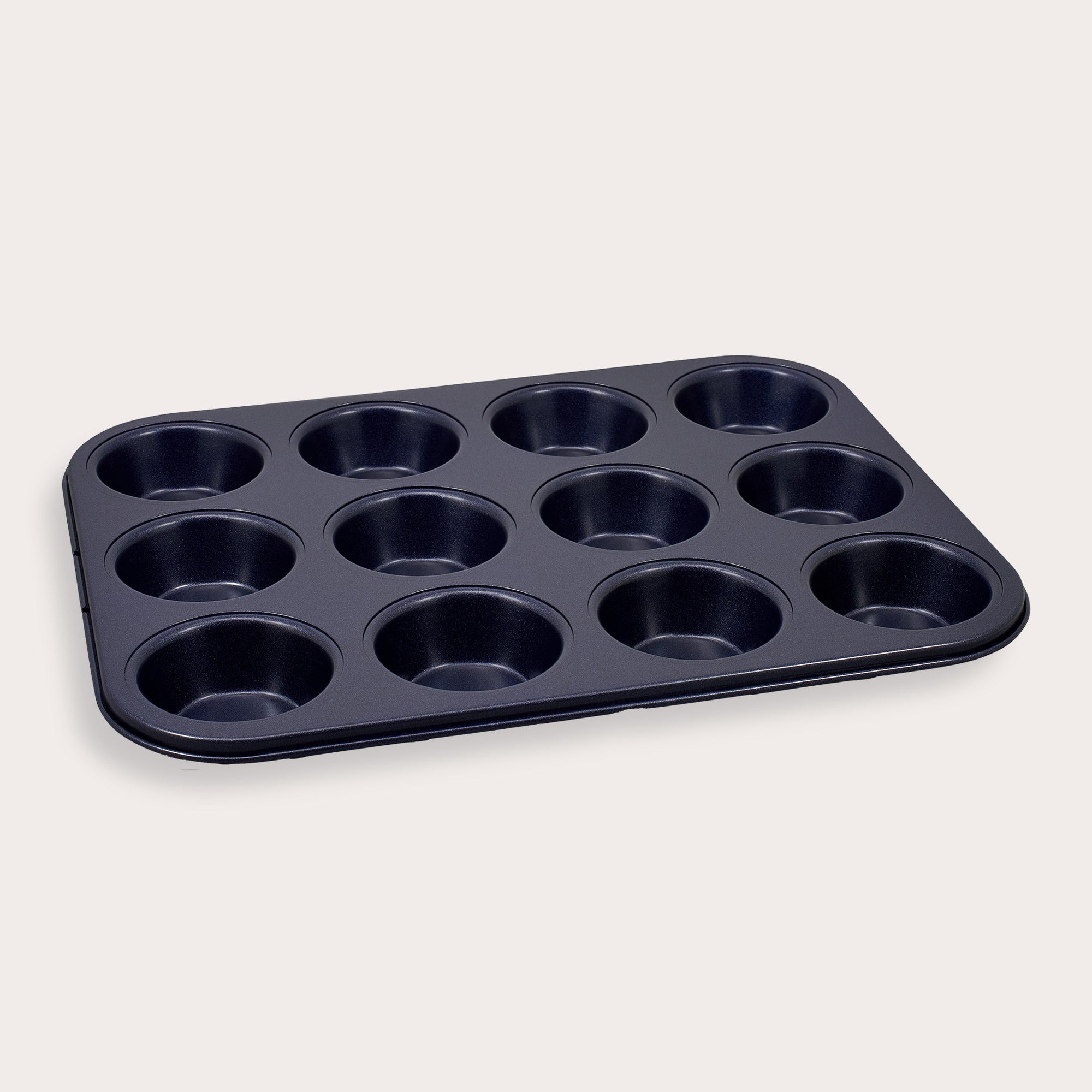 A non-stick, 12-cup muffin or cupcake baking tray is shown against a plain, light-colored background.