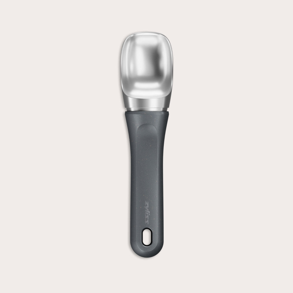 The Zyliss Ice Cream Scoop, featuring a wide deep bowl and eco-friendly handle, is displayed against a plain light background. 