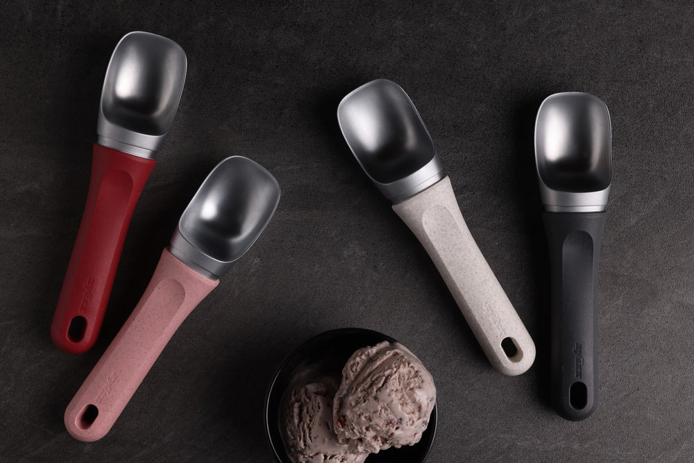 The Zyliss Ice Cream Scoop, featuring a wide deep bowl and eco-friendly handle, is displayed against a plain light background. 